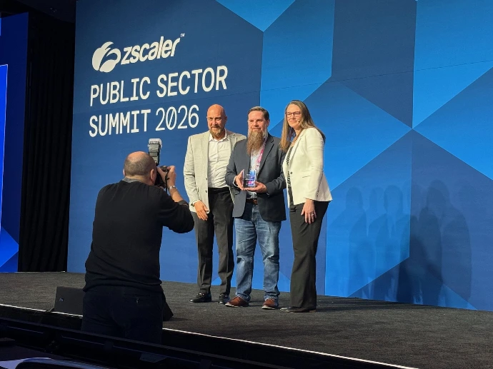 Intelligent Cloud LLC's Owner and CEO Virgil Simms accepting the 2026 Zscaler Public Sector Zero Trust Champion award on behalf of FAA Connect